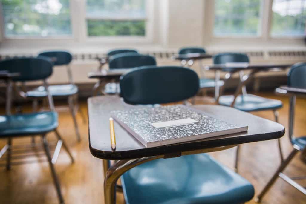 SRP Action: Hold. Image of desks in a classroom