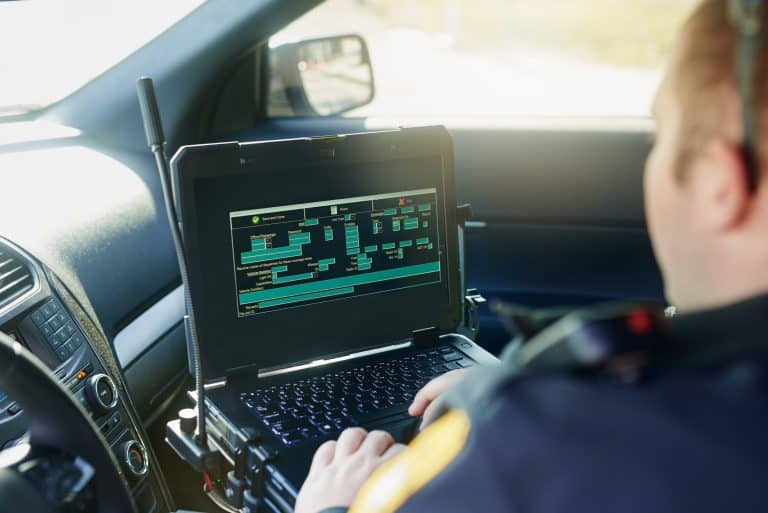 Police Connectivity - Law Enforcement Officer using in-car computer